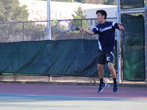 Sophomore Kevin Xiang returns the opponents serve, eventually winning the point.
