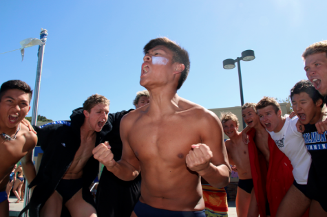 Sophomore Cameron Ho leads a team cheer before the meet begins. It was just fun to have our Senior Night and last home meet against our sister school, Sequoia. For PALs, Im hoping to get the record in the 200 IM race, said Ho.
