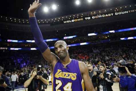 Los Angeles Lakers Kobe Bryant waves to the crowd after an NBA basketball game against the Philadelphia 76ers on Tuesday, Dec. 1, 2015, in Philadelphia. Philadelphia won that game 103-91.