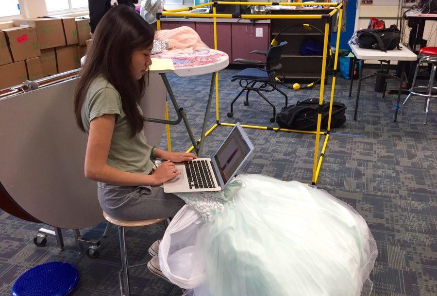 Sophomore and Do Something commissioner in ASB,  Katie Wong catalogues a dress that was donated to Gowns for Girls. 