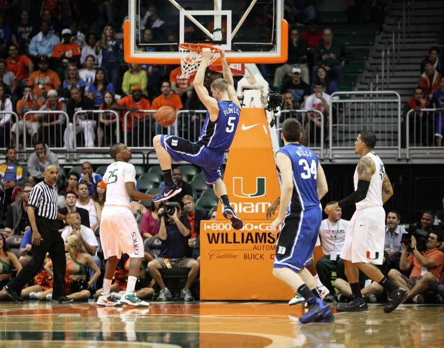 A Duke University player makes a basket during a game against the Miami Hurricanes. One of Dukes opponents was scheduled to play at the university, located in North Carolina. However, the game was canceled due to controversy over the HB2 law.