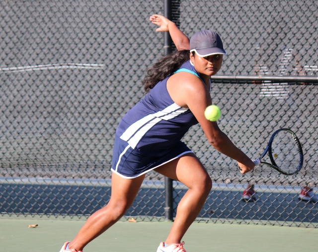 Senior Snehal Pandey sets herself up for a backhand return to gain the lead during her first set.