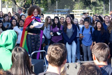 Students crowded around junior Rosie Asmar as she introduced the rally.