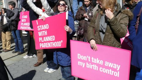 Participants at a rally in New York CIty demonstrate their support for Planned Parenthood. 