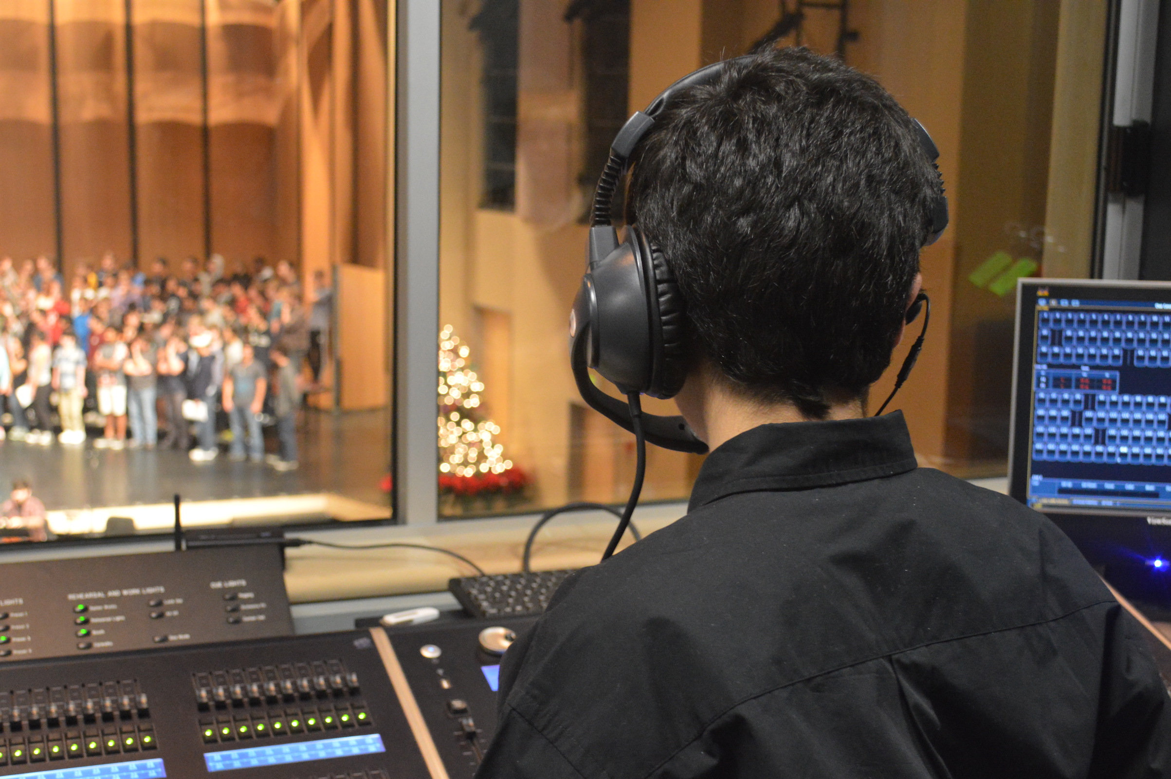 Freshman Andres Raddavero runs the light board during rehearsal for Carlmont’s winter choir show. During this rehearsal, Raddavero learns his cues for the upcoming performances.   