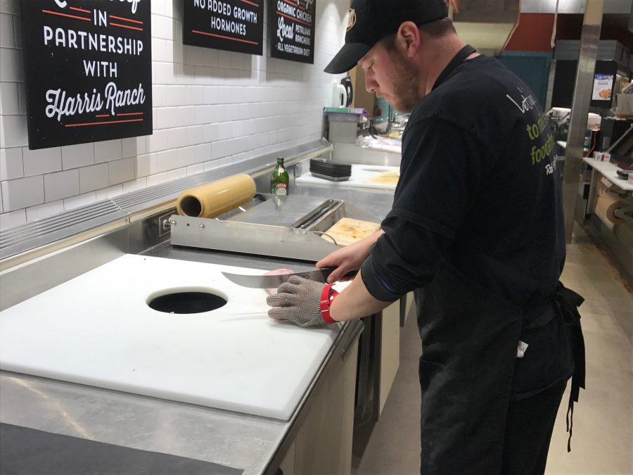 Kevin, a chef at the Meat Market at Nob Hill Foods, cuts up meat for his job. “I love working here, I’ve been here for about 18 years, it’s real fast pace and I like what I do. A lot of customer interaction, said Kevin.