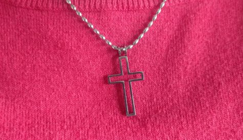 This friendship and faith cross belongs to Darby Bryan and her best friend who moved away. She had given the necklace to Bryan before she left and owns the inside of the cross as a symbol of friendship. 