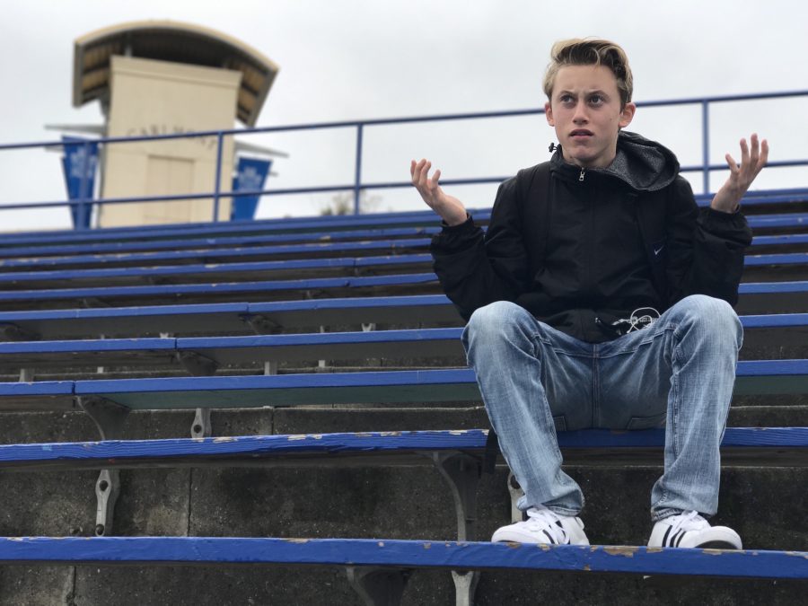 Gavin Blodgett, sophomore at Carlmont, sits down with his hands unbalanced as he questions his educators. For decades, schooling and education were created to intellectually develop individuals, but America has progressed slowly behind as the modern age evolves.  