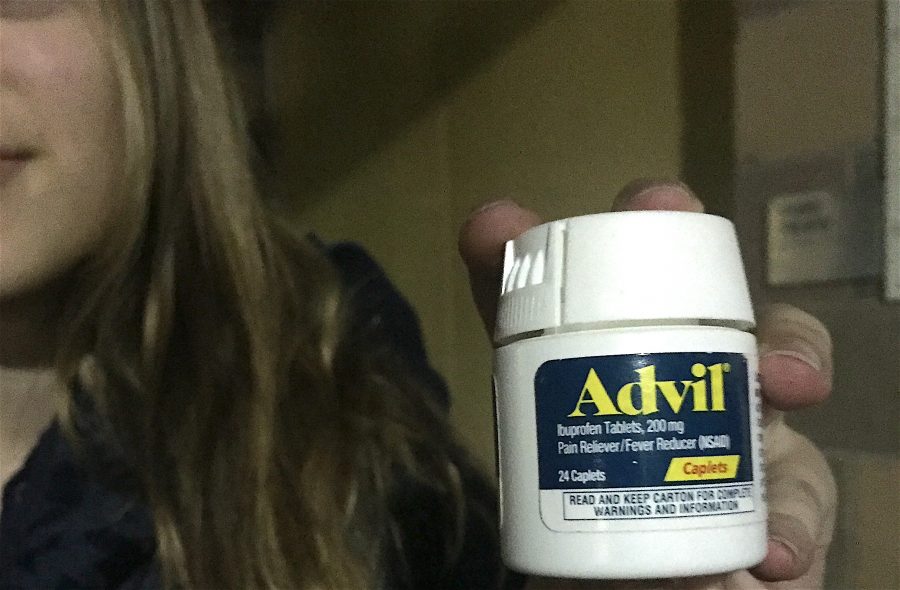 Téa Pusey, a junior, uses advil to deal with the pain she experiences on a regular basis. 