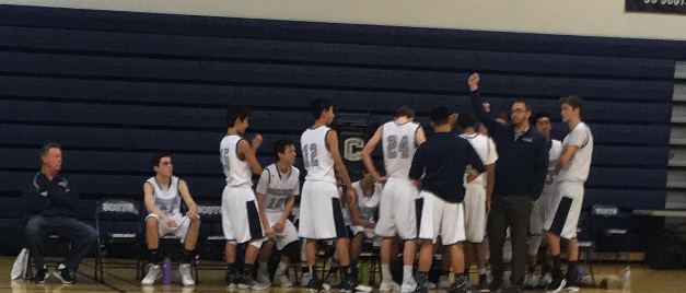 The JV Carlmont basketball team in huddle to start a game through the tough season ahead. Daniel Zorb, captain of the varsity basketball team at Carlmont was asked what got him through the season, “My teammates, we all are very close together and we got eachothers backs throughout the season.”

