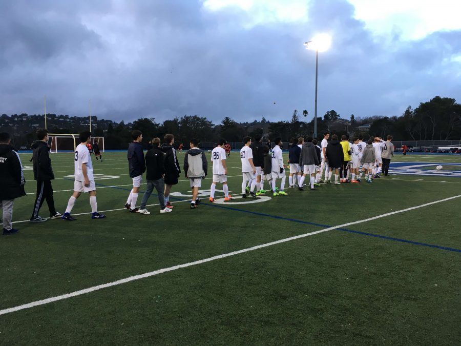 JV+Boys+Soccer+lines+up+to+shake+hands+with+Aragon+after+a+5-1+defeat.
