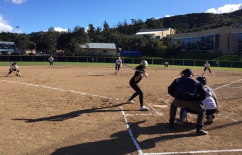 The Archbishop Mitty Warriors are up to bat against freshman Samantha Chu who is pitching for Carlmont during the 2nd inning of the game.