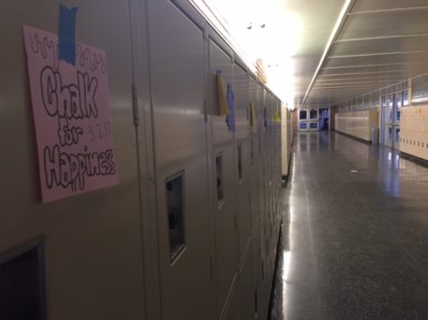 Hand drawn posters from the publicity commission are hung on lockers in C-hall. 