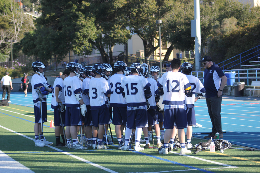 The Scots huddle on the sideline during their strong victory over Gunn.
