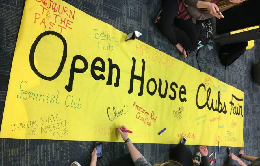 ASB Publicity Commission works on a poster to display at Open House's first Clubs Fair. 