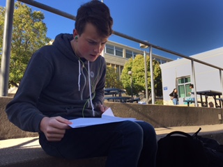 Sophomore Patrick McDonough reviews the answers to the math contests. Many students share their answers with each other after each contest to check if they got the right answer.