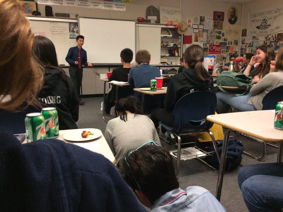 Justin Som, a junior running for club president, addresses Mock Trial during their final meeting in E2.