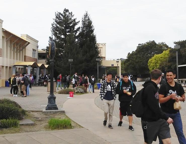 Students enjoy the clean campus as they stroll through the quad to throw away their food.