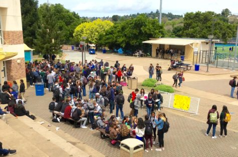 Students wait in a long line  in order to buy their prom ticket