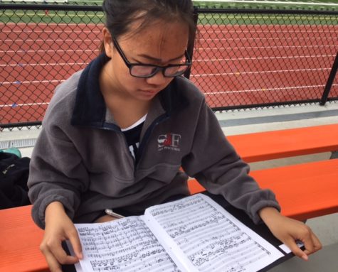 Jessica Lui, a sophomore in Concert Choir, reviews her music for Wolfgang Mozarts Coronation Mass before the trip to New York.