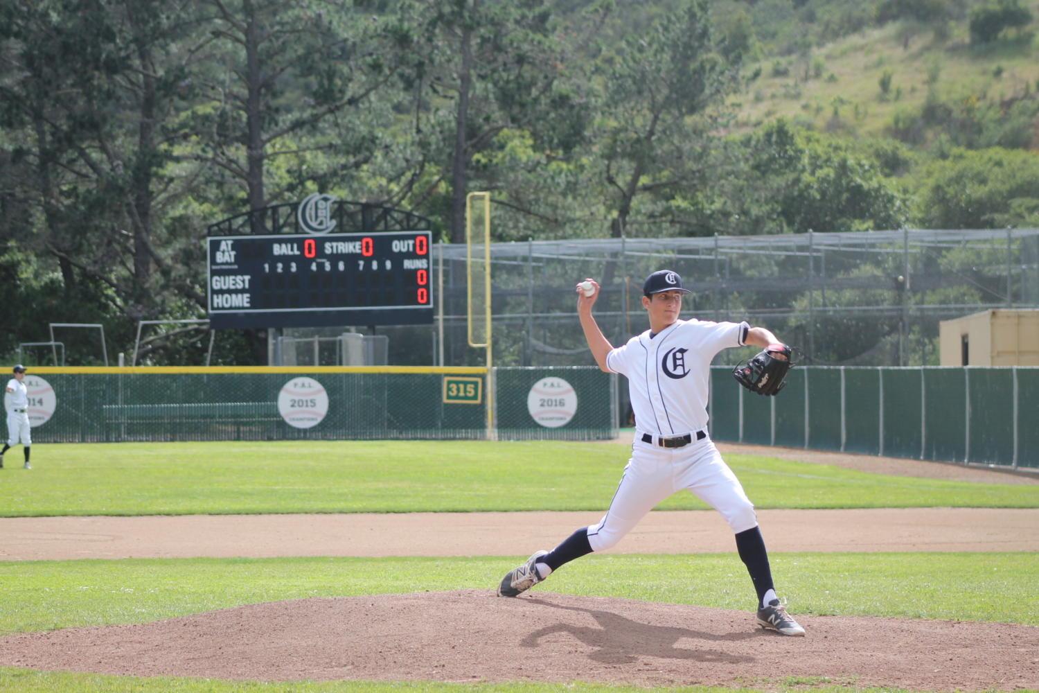 Sophomore David Bedrosian warms up on the mount before the game against Burlingame. Carlmont beat Burlingame 8-3 on April 26. Bedrosian would pitch for 5 innings and contribute to many of Carlmont's points with his hits. 