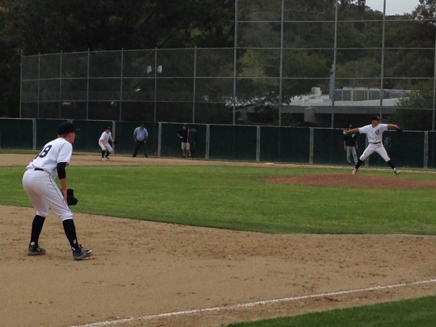 Tyler DeSmidt (left) gets in position as David Bedrosian launches a strike.