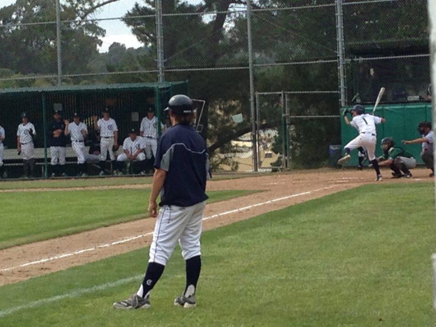 Zack Burgos times his swing in the sixth inning, as the Carlmont dugout watches eagerly.