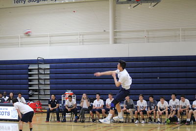 Senior Chris Ding serves a rocket for an ace in the second set to try and mount a comeback.