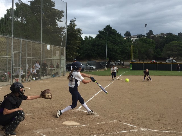 Cierra Stratton, a junior, hits a ball pitched during the JV girls softball game on April 4.