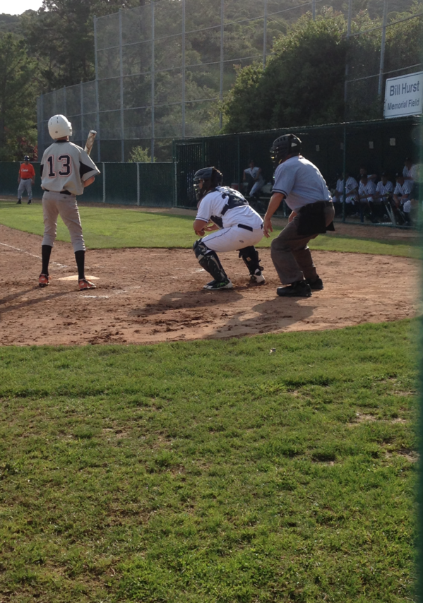 Catcher Ben Fong gets ready to fire down to second to catch a runner trying to steal.