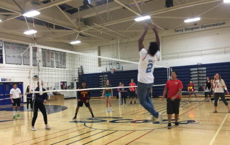 Demarii Blanks, a junior, goes to set the ball to his teammates to spike for a point.