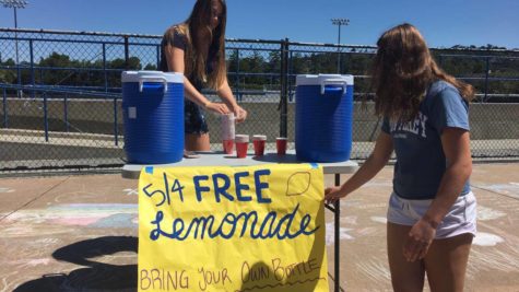 Liz Boman, a member of the ASB do something commission sets up for the lemonade stand at lunch.