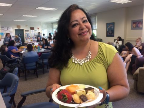 Rosa Argaluza, a Spanish teacher, gets food in the Teachers Lounge during the Vivace Luncheon for Teacher Appreciation Week.