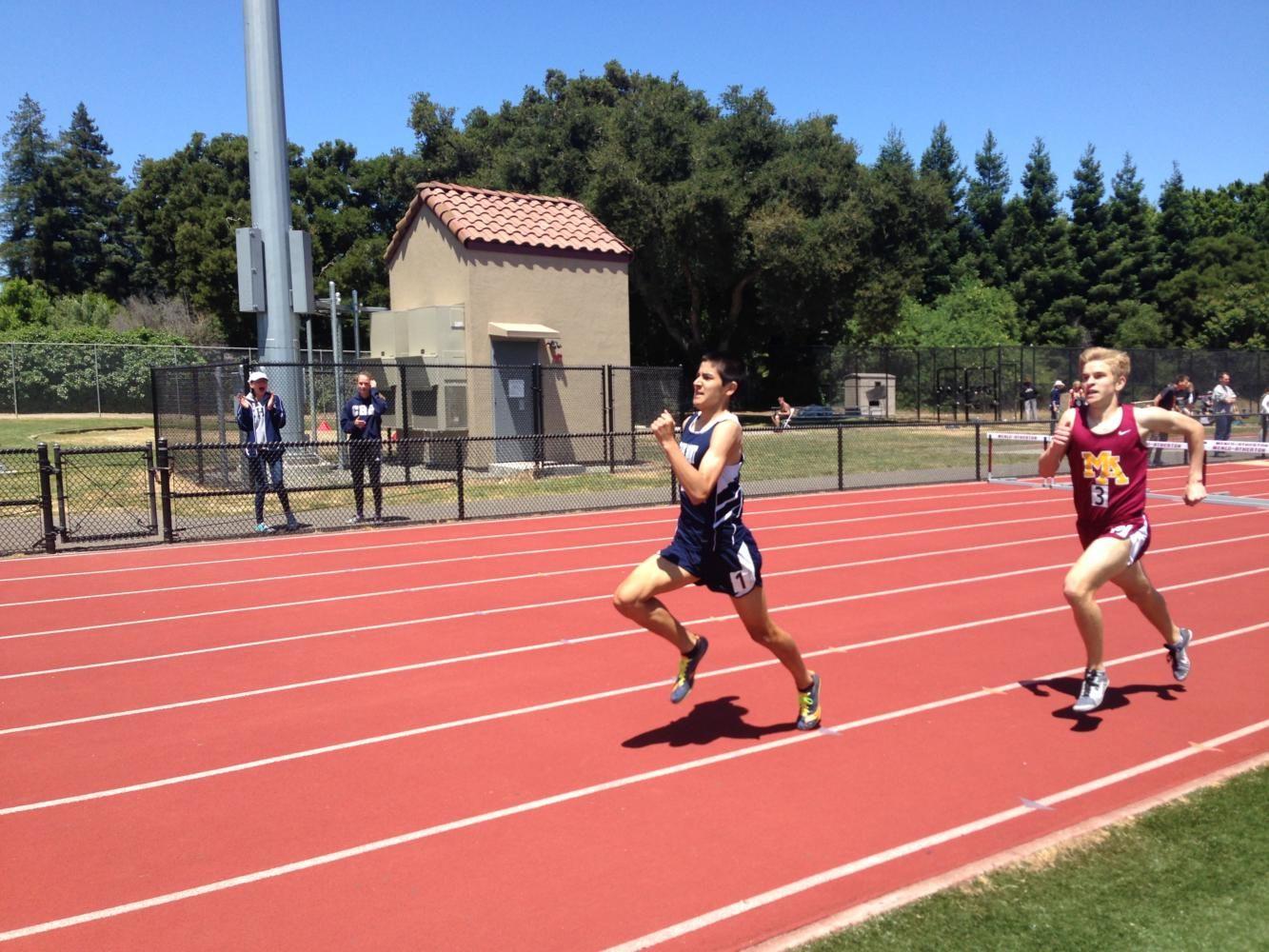 Ryan Wilson, a junior, sprints into first place during the 800m race.
