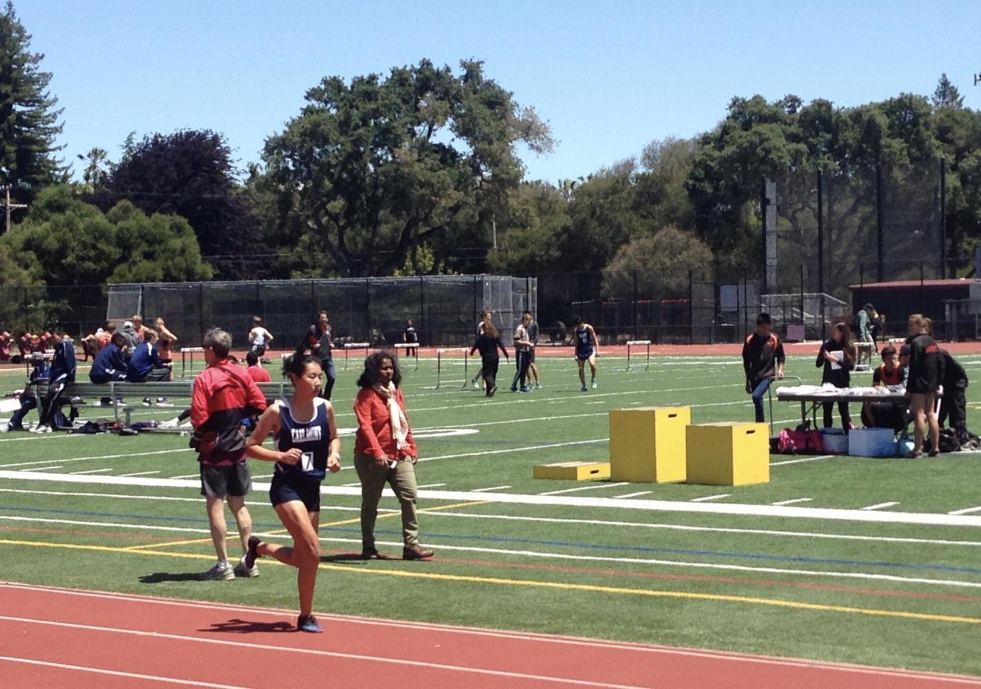 Megan Uozumi strides to the finish line during the 3200m race.