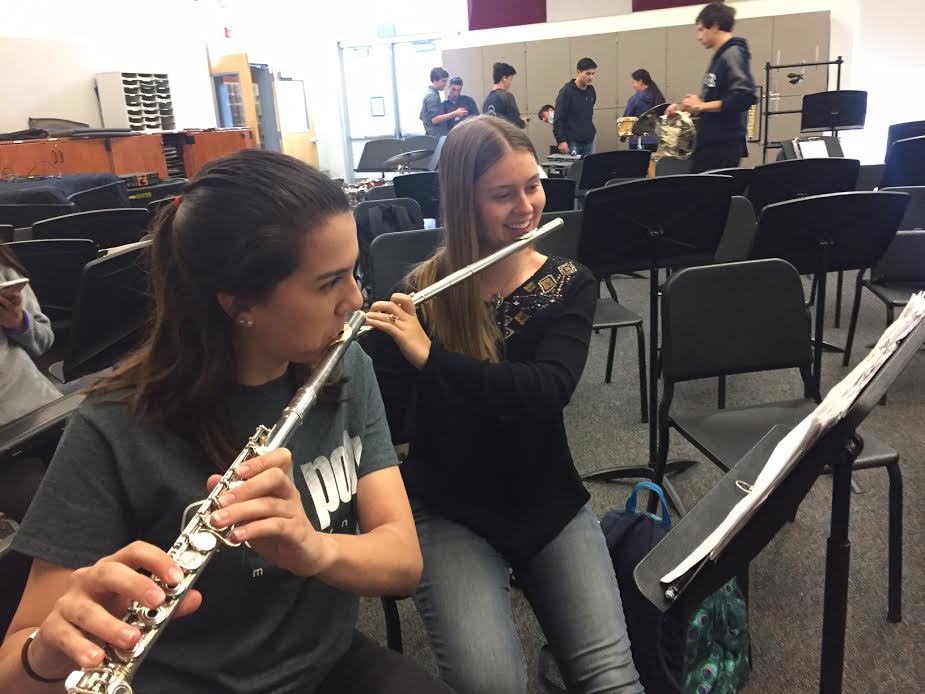 Seniors Allison Chavez and Hanna Francis play their flutes in preparation for their last Carlmont performance.