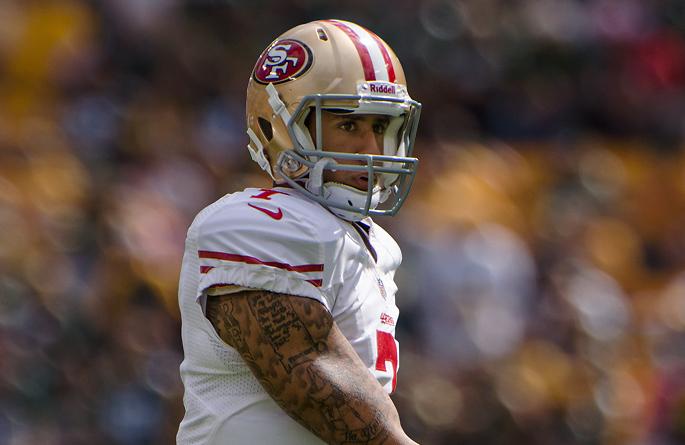 Colin+Kaepernick+stands+on+the+field+before+a+game.+He+is+not+yet+signed+to+play+in+the+NFLs+2017+season.
