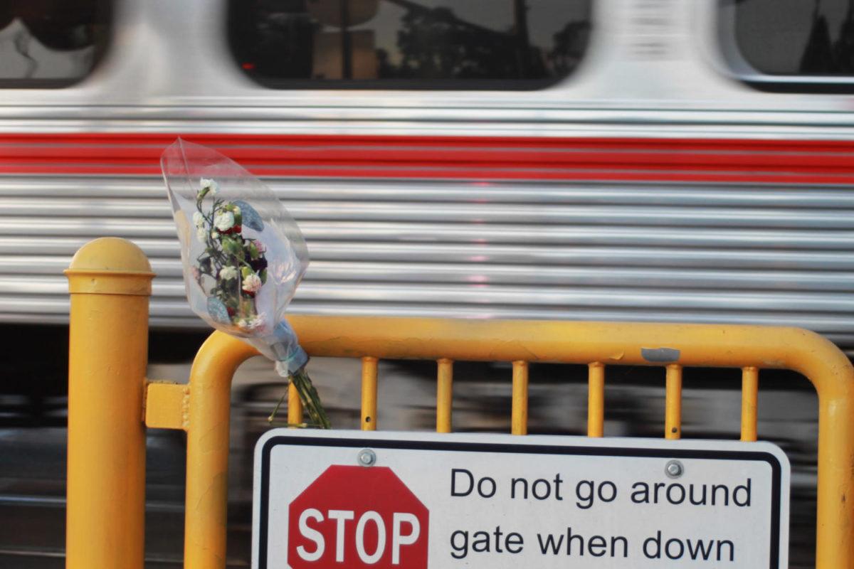 Flowers lay at the Whipple Avenue railroad crossing in Redwood City in memory of Sequoia High School freshman Holly Spalletta.