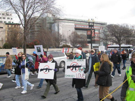 Protesters marching to fight for stricter gun control after the Sandy Hook shooting in 2013.