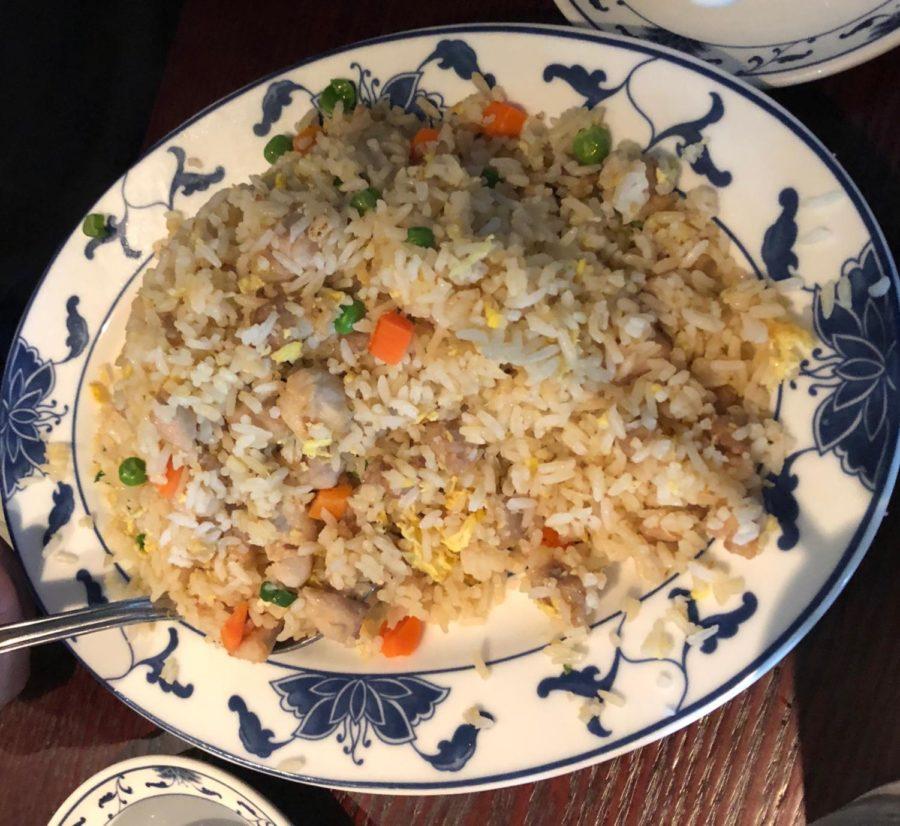 Gin Mons chicken fried rice: a stir fried mix of peas, egg, chicken, carrot, and rice.