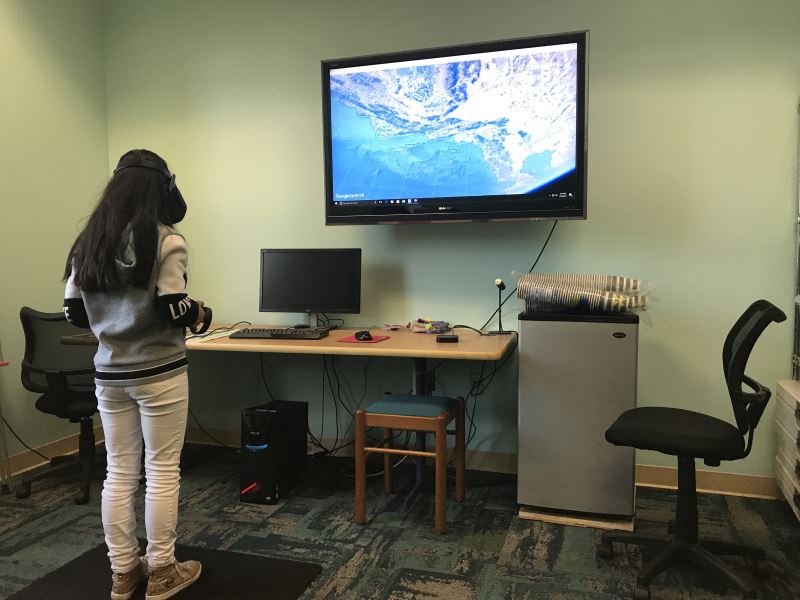 Ndyeli Hernandez, a seventh grader, uses the Google Earth VR program to explore Paris and New York. 