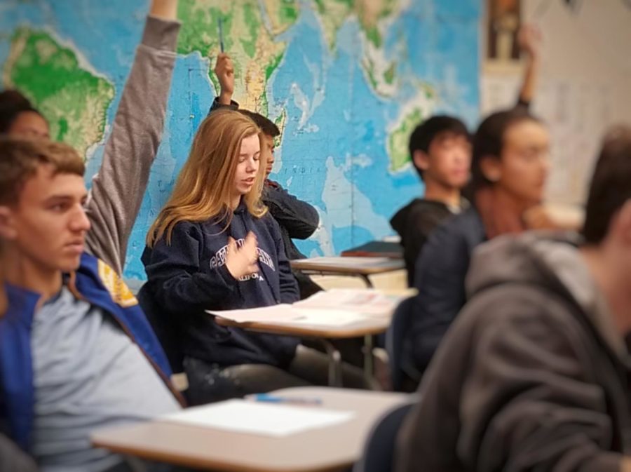 Sophomore Sophia Krackov answers a question in her AP European history class. Krackov said, You definitely have to be committed in order to do well.