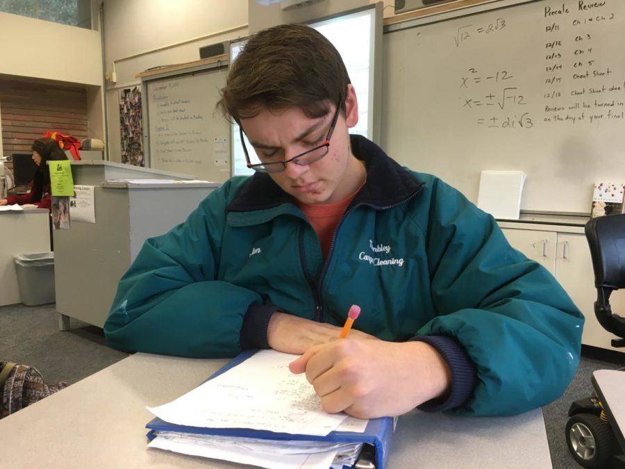 Paul Trembley, a junior, studies for his finals during review week.