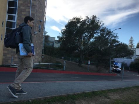 Tomas Ronderos, a sophomore, walks from Carlmont High School with textbooks in hand, ready to prepare for the SAT and future successes.
