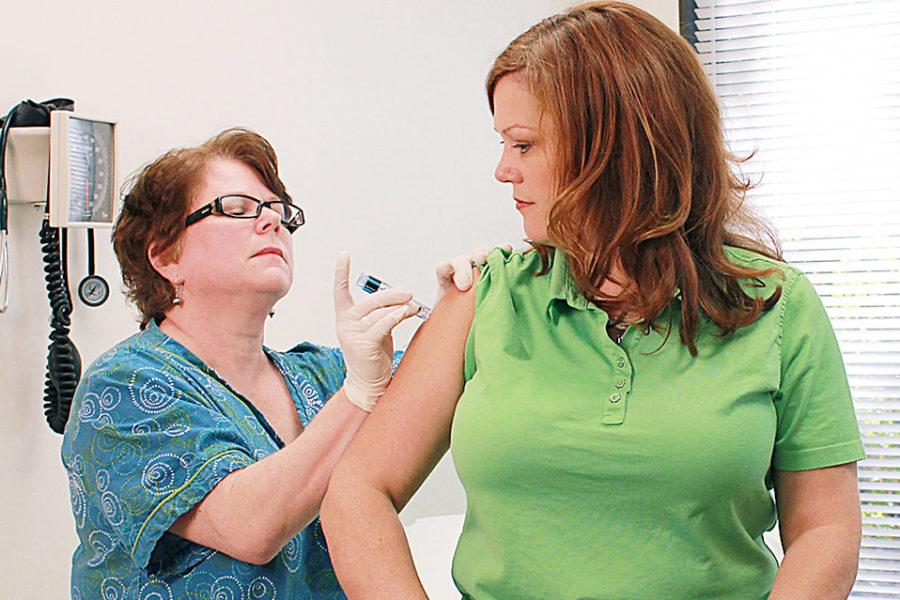 A nurse administers a flu vaccine. This years vaccine is only 10 to 30 percent effective against the virus.