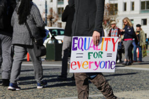 In addition to supporting womens rights, marchers also hold signs for sexuality and identity equality.