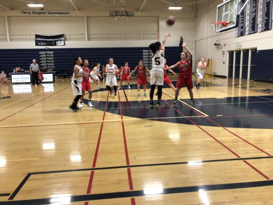 Valerie Kuo goes in for a 3 pointer to keep Carlmont in the lead.