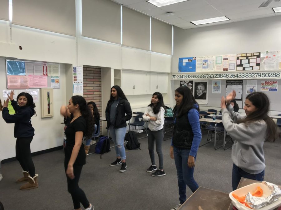 Club members practice a dance for the upcoming Heritage Fair