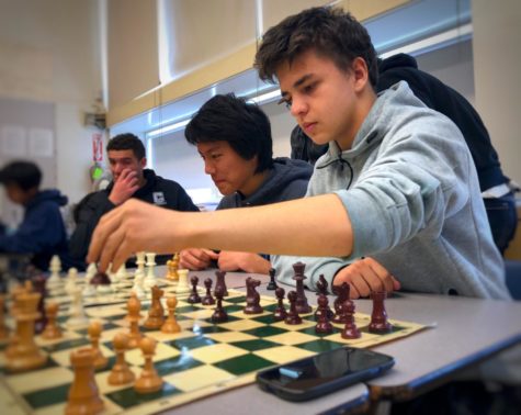 Junior Andrey Shapiro plays in a chess match with his peer during one of Chess Club’s regular Friday lunch meetings in D10.