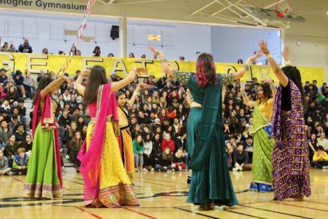 Indian Club dances wearing traditional Indian lenghas. 